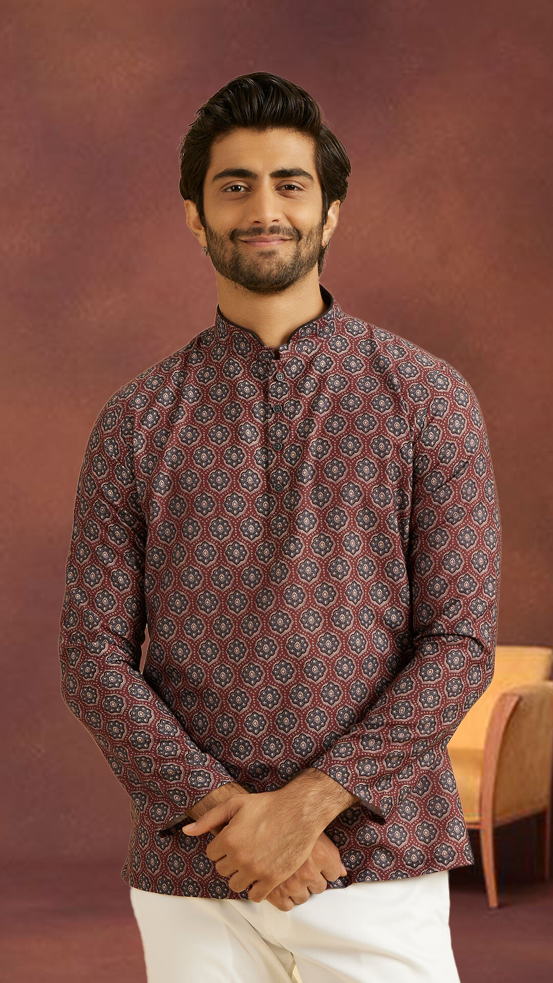 Man wearing a stylish pattern kurta and  White pant set for a pre-wedding function